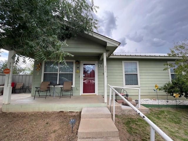 311 S 6th St, Alpine, TX 79830 - property entrance with covered porch and a metal roof