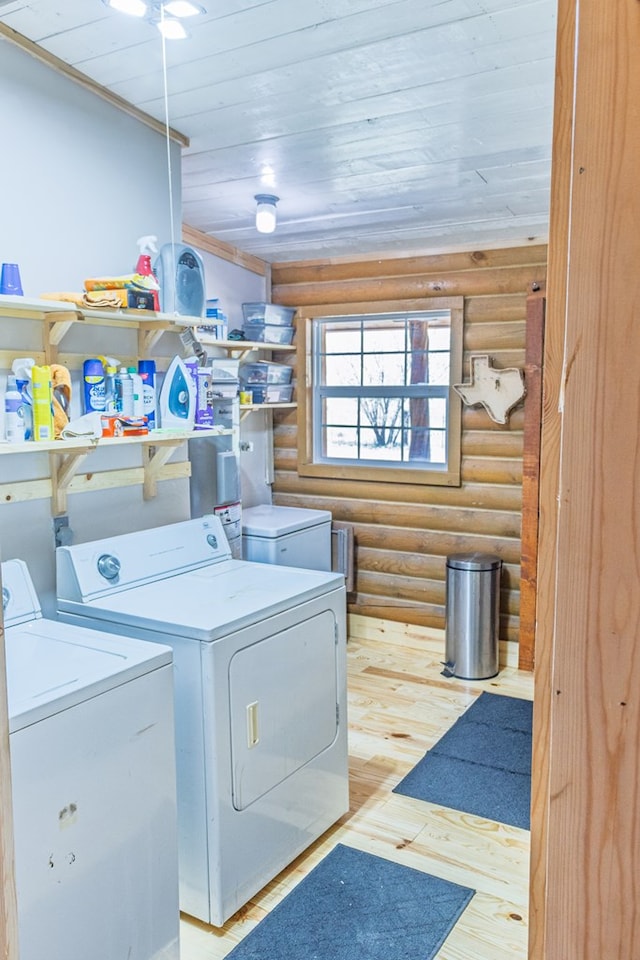 43169 State Highway 17, Fort Davis, TX 79734 - laundry area with independent washer and dryer, log walls, wood-type flooring, and wood ceiling