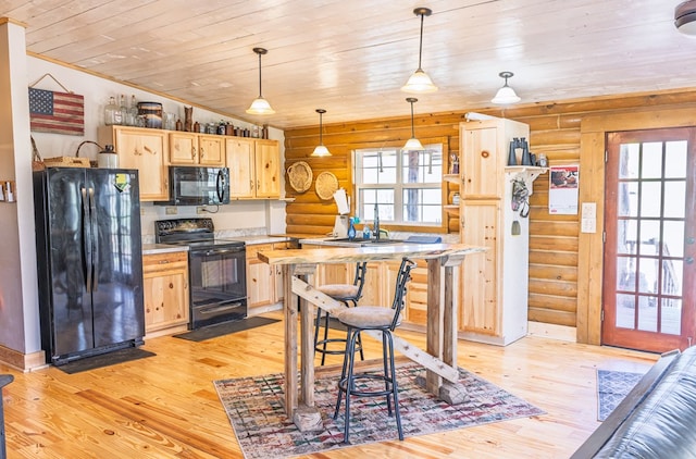 43169 State Highway 17, Fort Davis, TX 79734 - kitchen featuring black appliances, log walls, wood ceiling, light brown cabinetry, and light wood-style flooring