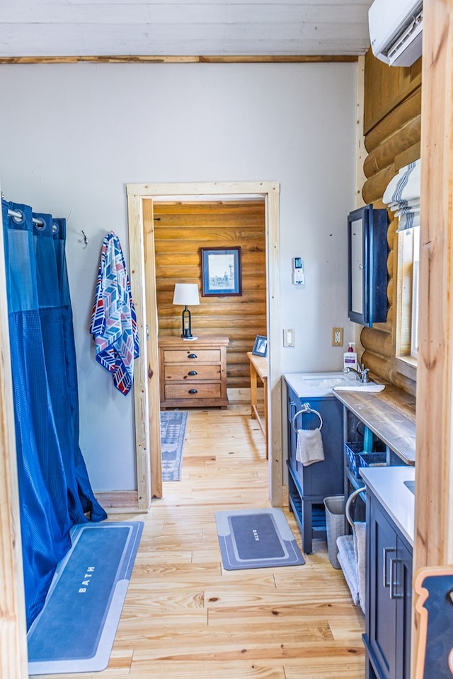 43169 State Highway 17, Fort Davis, TX 79734 - home office featuring log walls, light wood-type flooring, and an AC wall unit