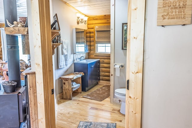 43169 State Highway 17, Fort Davis, TX 79734 - bathroom with rustic walls, hardwood / wood-style floors, wood ceiling, and vanity