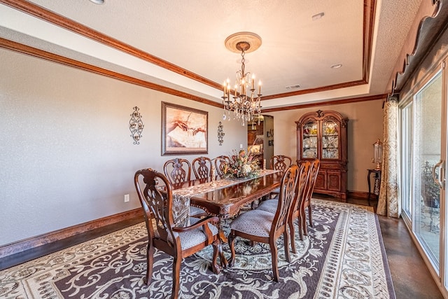 651 Fm 1757, Seminole, TX 79360 - dining room with a chandelier, a raised ceiling, ornamental molding, and a textured ceiling