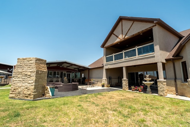 651 Fm 1757, Seminole, TX 79360 - back of property with a patio area, a lawn, and stucco siding
