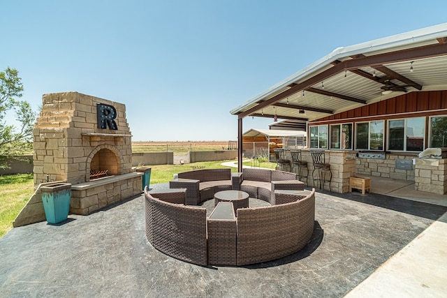 651 Fm 1757, Seminole, TX 79360 - view of patio / terrace with an outdoor stone fireplace, exterior kitchen, and a ceiling fan