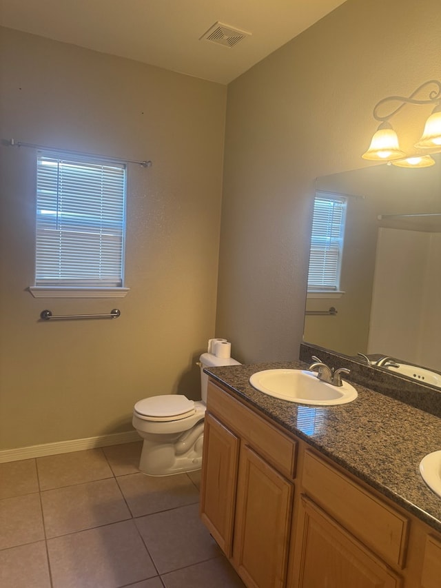 903 W Uvalde Ave, Alpine, TX 79830 - bathroom featuring double vanity, tile patterned flooring, and plenty of natural light