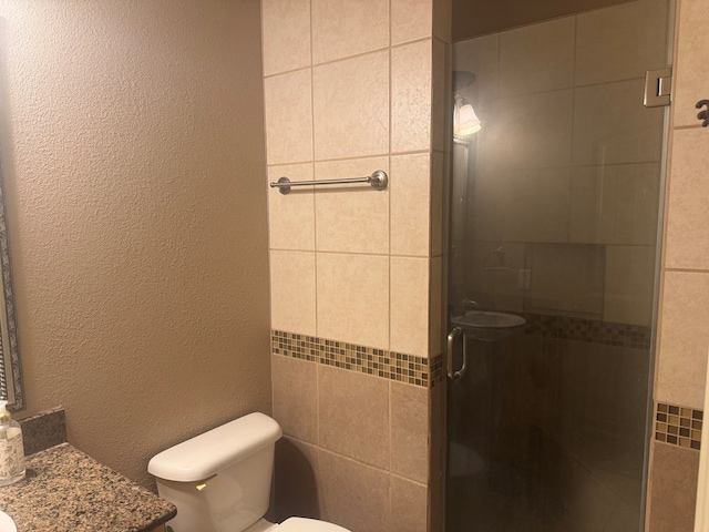 903 W Uvalde Ave, Alpine, TX 79830 - full bath with a shower stall, vanity, and a textured wall
