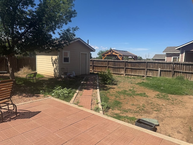 903 W Uvalde Ave, Alpine, TX 79830 - fenced backyard featuring a patio and an outbuilding