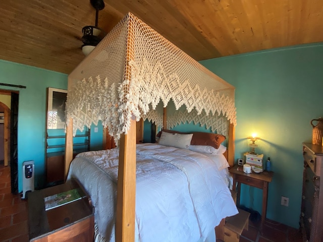 bedroom with lofted ceiling and wooden ceiling