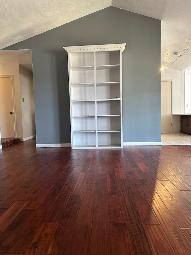 1844 E 50th St, Odessa, TX 79762 - spare room with hardwood / wood-style flooring and vaulted ceiling