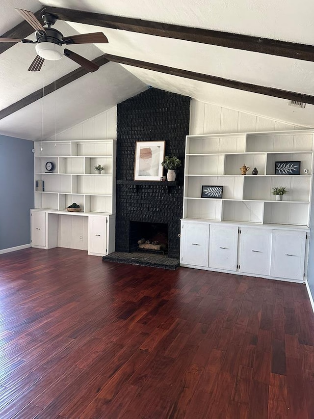 1844 E 50th St, Odessa, TX 79762 - unfurnished living room featuring dark wood-style flooring, a ceiling fan, and a fireplace