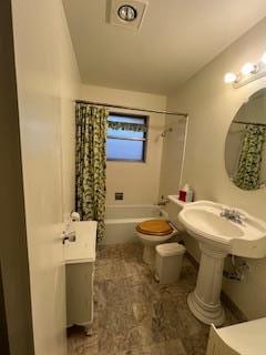 bathroom with shower / bath combo and toilet