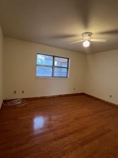 spare room featuring dark hardwood / wood-style floors