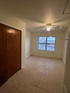 unfurnished room with ceiling fan