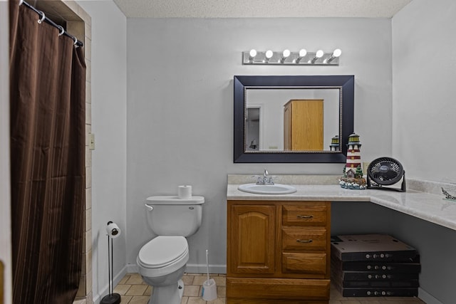full bath featuring toilet, tile patterned flooring, vanity, and a textured ceiling
