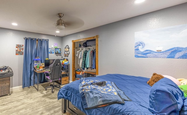 113 County Rd 405, Seminole, TX 79360 - bedroom with wood finished floors, a closet, recessed lighting, ceiling fan, and an office area