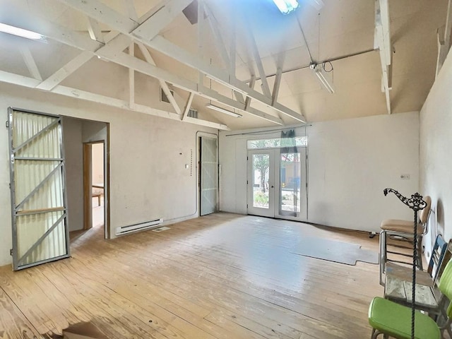 308 E Murphy St, Marfa, TX 79843 - interior space with french doors, a baseboard radiator, hardwood / wood-style floors, and high vaulted ceiling