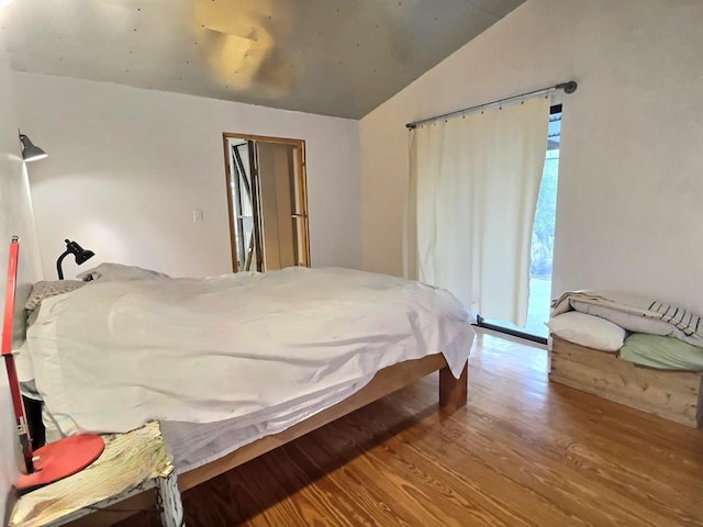 308 E Murphy St, Marfa, TX 79843 - bedroom featuring vaulted ceiling and wood finished floors
