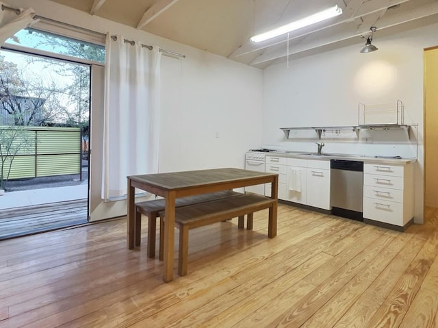 308 E Murphy St, Marfa, TX 79843 - kitchen with dishwasher, a sink, white cabinetry, light wood-style floors, and light countertops