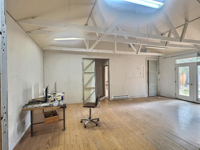 308 E Murphy St, Marfa, TX 79843 - misc room with a baseboard heating unit, hardwood / wood-style floors, french doors, and vaulted ceiling