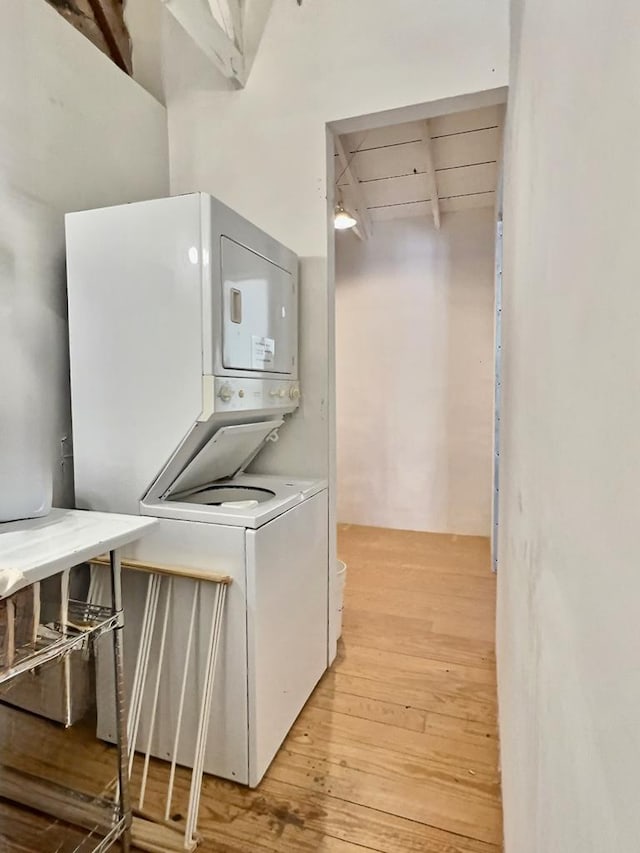 308 E Murphy St, Marfa, TX 79843 - washroom with light wood-style floors, laundry area, and stacked washer and clothes dryer