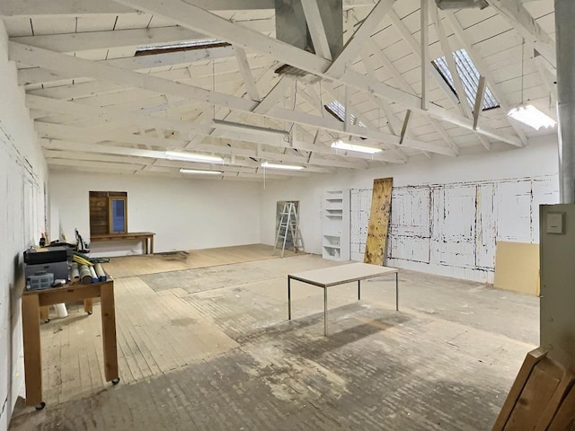 308 E Murphy St, Marfa, TX 79843 - misc room featuring high vaulted ceiling, a skylight, and hardwood / wood-style floors