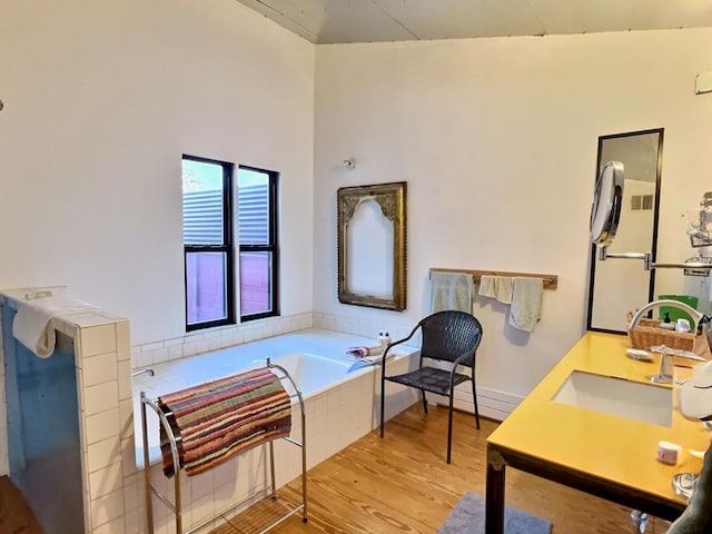 308 E Murphy St, Marfa, TX 79843 - full bathroom with a bath, visible vents, wood finished floors, and vanity