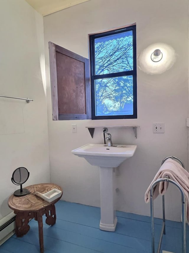 308 E Murphy St, Marfa, TX 79843 - bathroom featuring a baseboard radiator