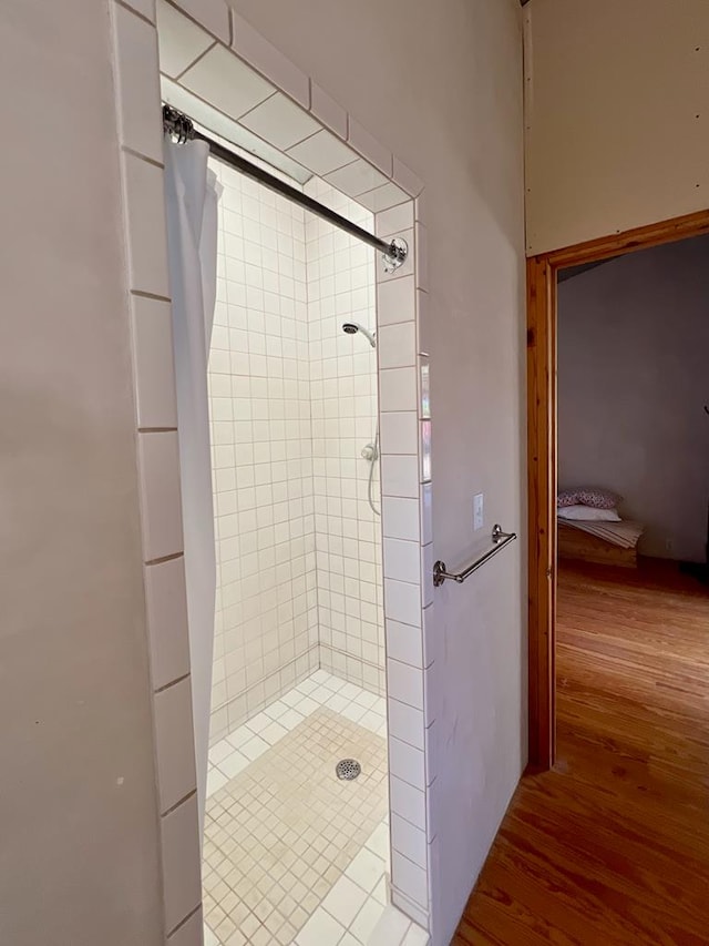 308 E Murphy St, Marfa, TX 79843 - bathroom with a stall shower and wood finished floors
