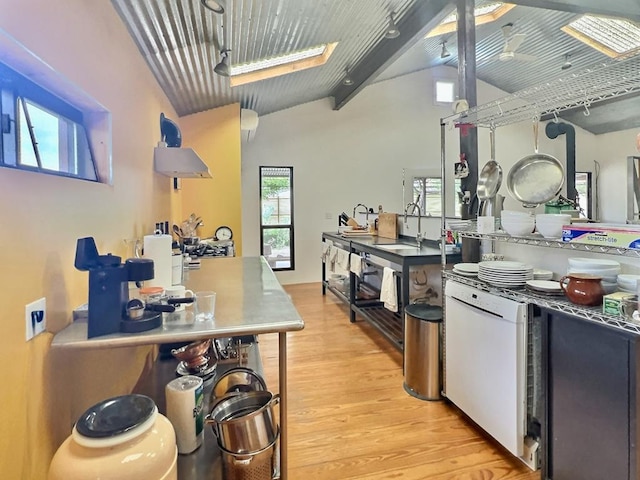 308 E Murphy St, Marfa, TX 79843 - kitchen featuring light wood-style flooring, a sink, white dishwasher, and vaulted ceiling with beams