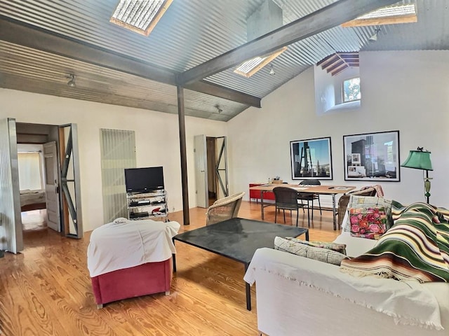 308 E Murphy St, Marfa, TX 79843 - living area with high vaulted ceiling, a skylight, and wood finished floors