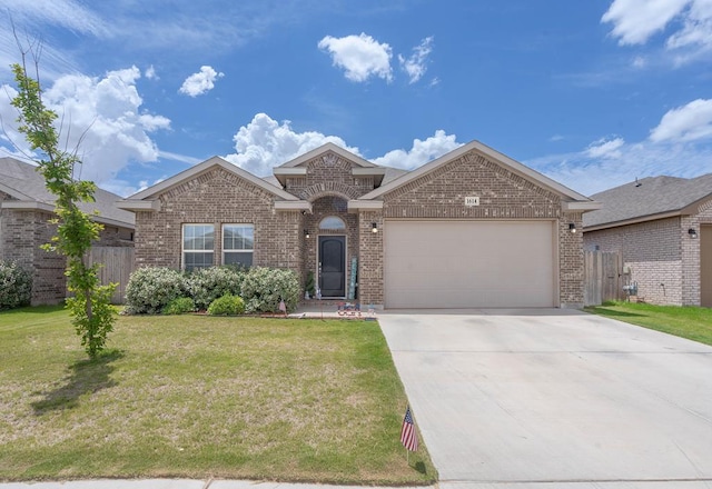 1614 Laguna Meadows Trl, Midland, TX 79705 - view of front of property featuring brick siding, an attached garage, and concrete driveway