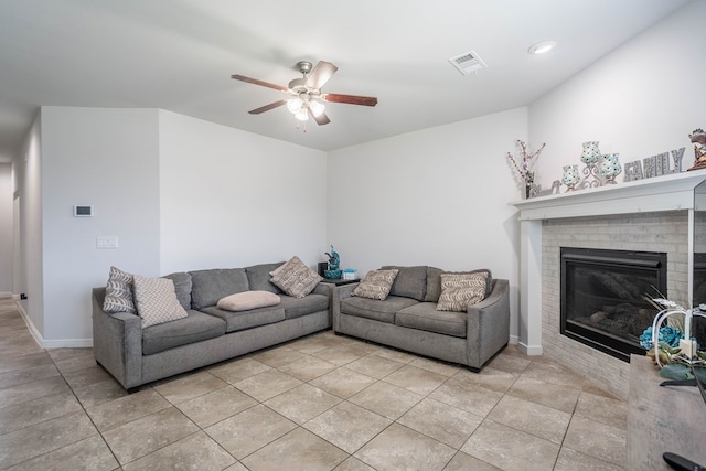 1614 Laguna Meadows Trl, Midland, TX 79705 - living room featuring ceiling fan, light tile patterned flooring, a brick fireplace, and recessed lighting