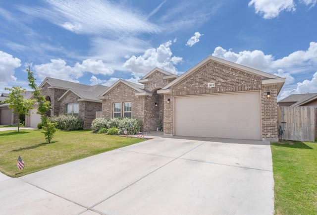 1614 Laguna Meadows Trl, Midland, TX 79705 - ranch-style home with brick siding, an attached garage, and concrete driveway