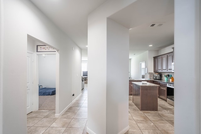 1614 Laguna Meadows Trl, Midland, TX 79705 - hall featuring light tile patterned flooring and recessed lighting