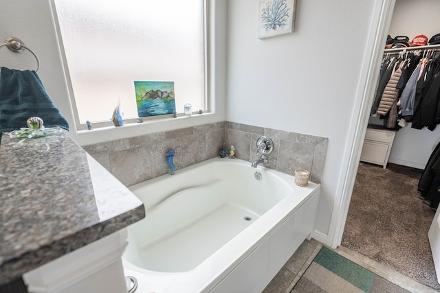 1614 Laguna Meadows Trl, Midland, TX 79705 - bathroom with a garden tub and a spacious closet
