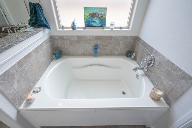 1614 Laguna Meadows Trl, Midland, TX 79705 - bathroom featuring a garden tub and plenty of natural light