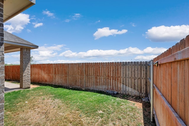 view of yard with a fenced backyard