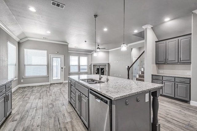 kitchen featuring dishwasher, visible vents, gray cabinetry, and crown molding