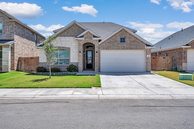 view of front of house featuring fence, brick siding, concrete driveway, a garage, and a front lawn