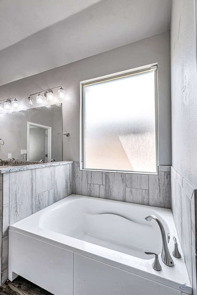 full bathroom featuring a wealth of natural light and a bath
