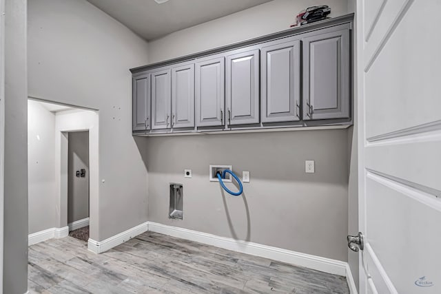 laundry area with light wood finished floors, cabinet space, washer hookup, hookup for an electric dryer, and baseboards