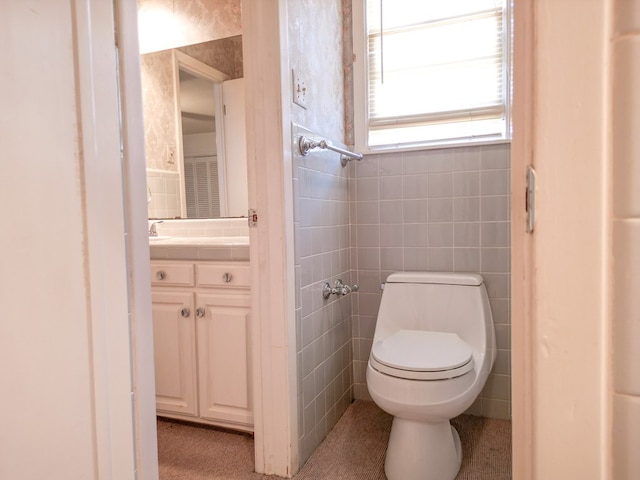 2809 E 17th St, Odessa, TX 79761 - bathroom featuring vanity and tile walls