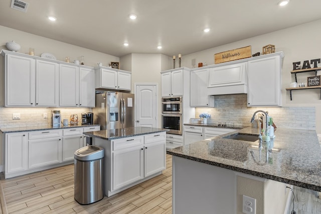 1214 Yancy St, Odessa, TX 79765 - kitchen featuring appliances with stainless steel finishes, white cabinetry, and recessed lighting