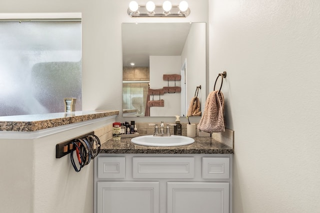 1214 Yancy St, Odessa, TX 79765 - bathroom featuring vanity and an enclosed shower