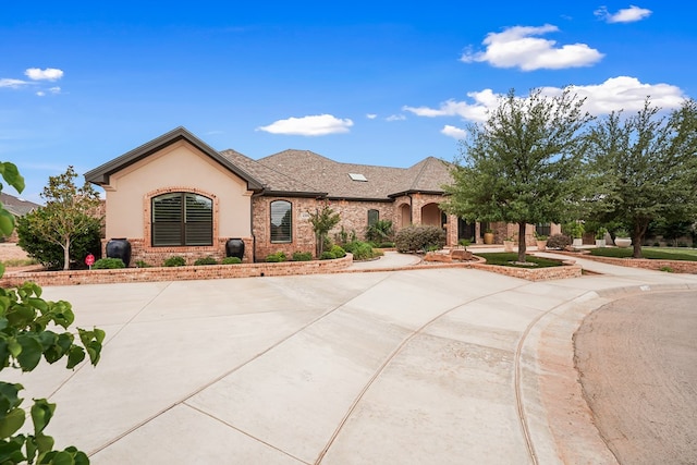 4309 Greenville Dr, Midland, TX 79705 - french country style house featuring brick siding