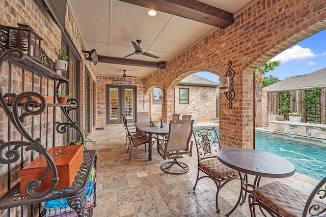 4309 Greenville Dr, Midland, TX 79705 - fenced backyard featuring a patio area, a ceiling fan, outdoor dining space, and an outdoor pool