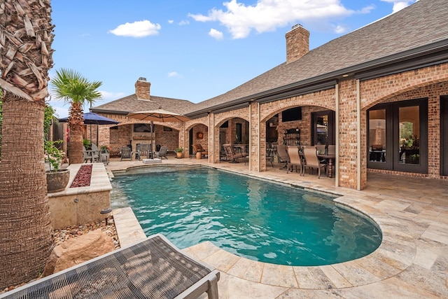 4309 Greenville Dr, Midland, TX 79705 - swimming pool with outdoor dining area, a patio area, and french doors