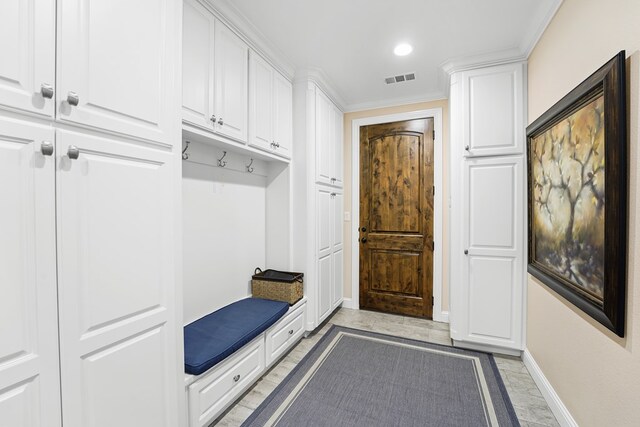 4309 Greenville Dr, Midland, TX 79705 - mudroom with light marble finish floors, crown molding, and recessed lighting