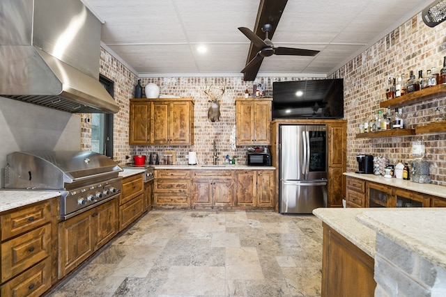 4309 Greenville Dr, Midland, TX 79705 - kitchen with smart refrigerator, extractor fan, stone tile floors, brown cabinetry, and brick wall