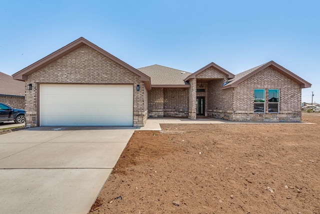 12045 W Palomino Ave, Odessa, TX 79764 - ranch-style house with brick siding, a garage, and concrete driveway